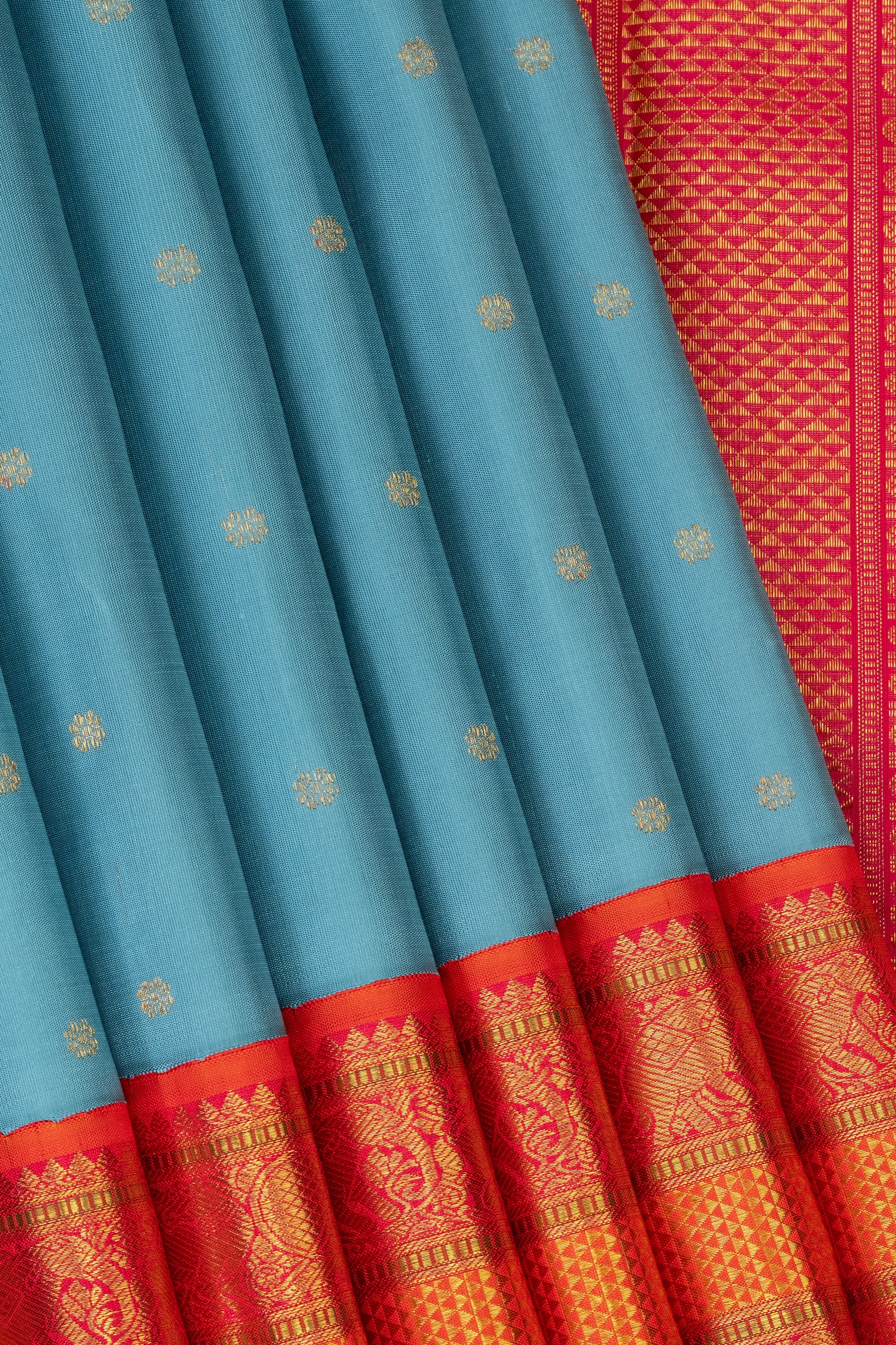 Turquoise blue saree with Orange Korvai border