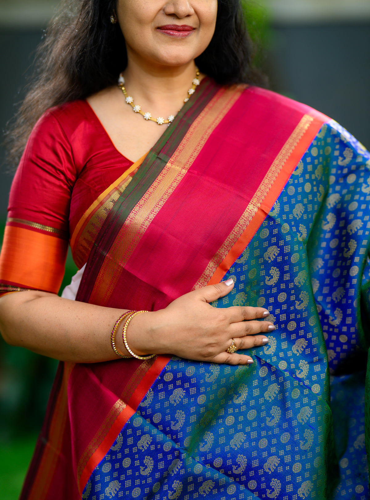 Korvai Kanjivaram with Peacock Green Body and Kalyana Arakku Border