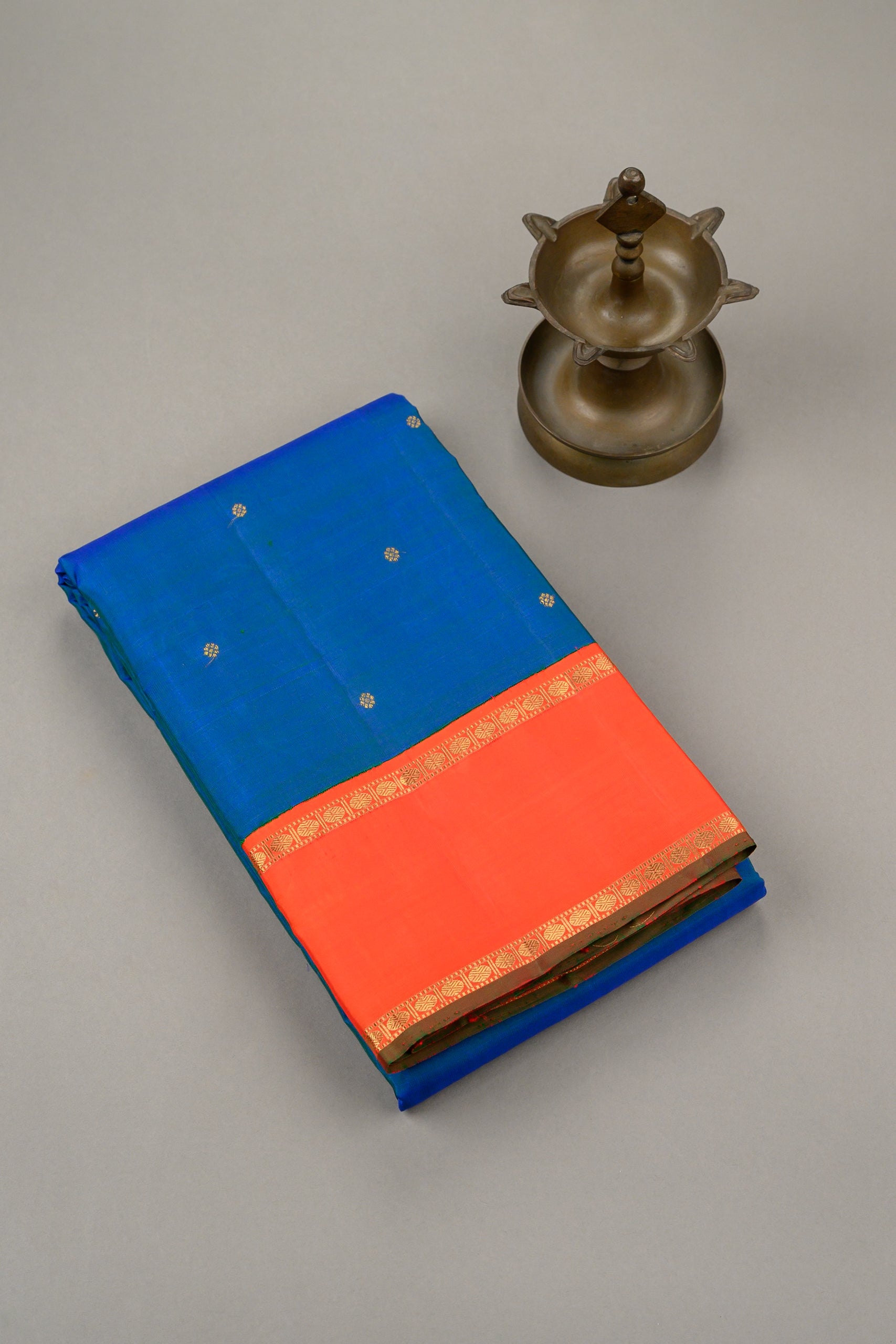 Mayilkazhuthu Blue Korvai Kanjivaram with Rettapettu Orange Border