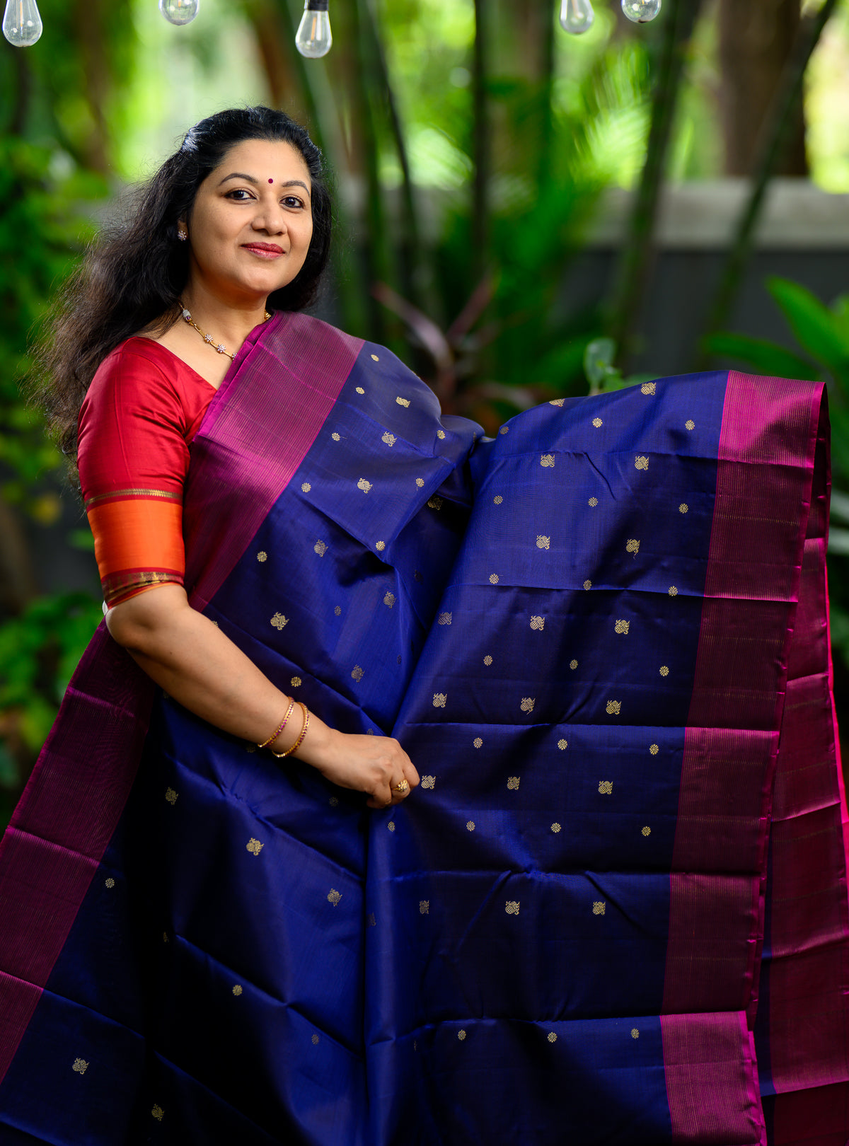 Beautiful pure silk, pure zari semi-contrast Kanchivaram in a striking combination of deep navy blue and rich magenta.