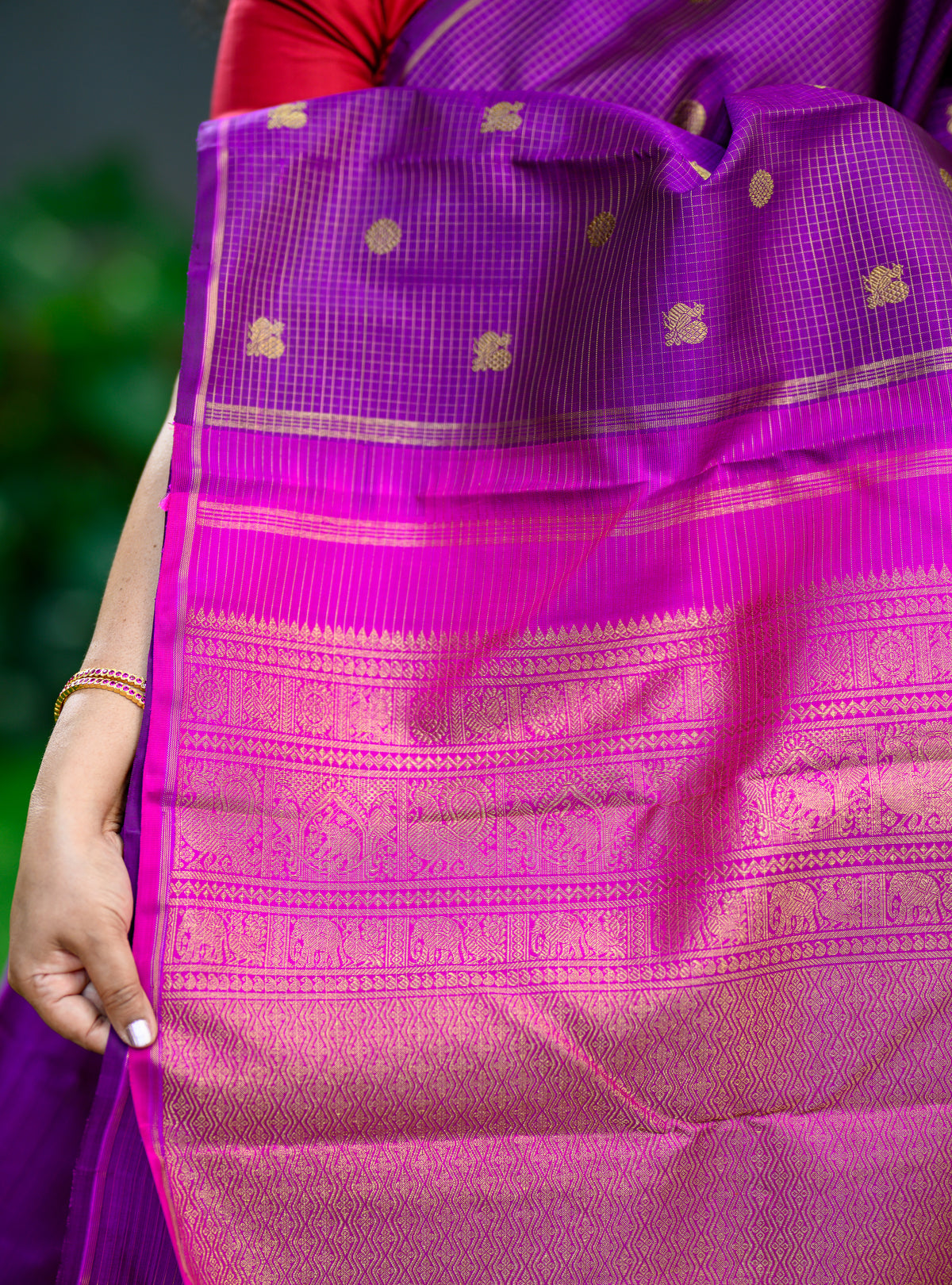A beautiful Pure Silk Pure Zari Borderless Kanchivaram in a rich purple shade.