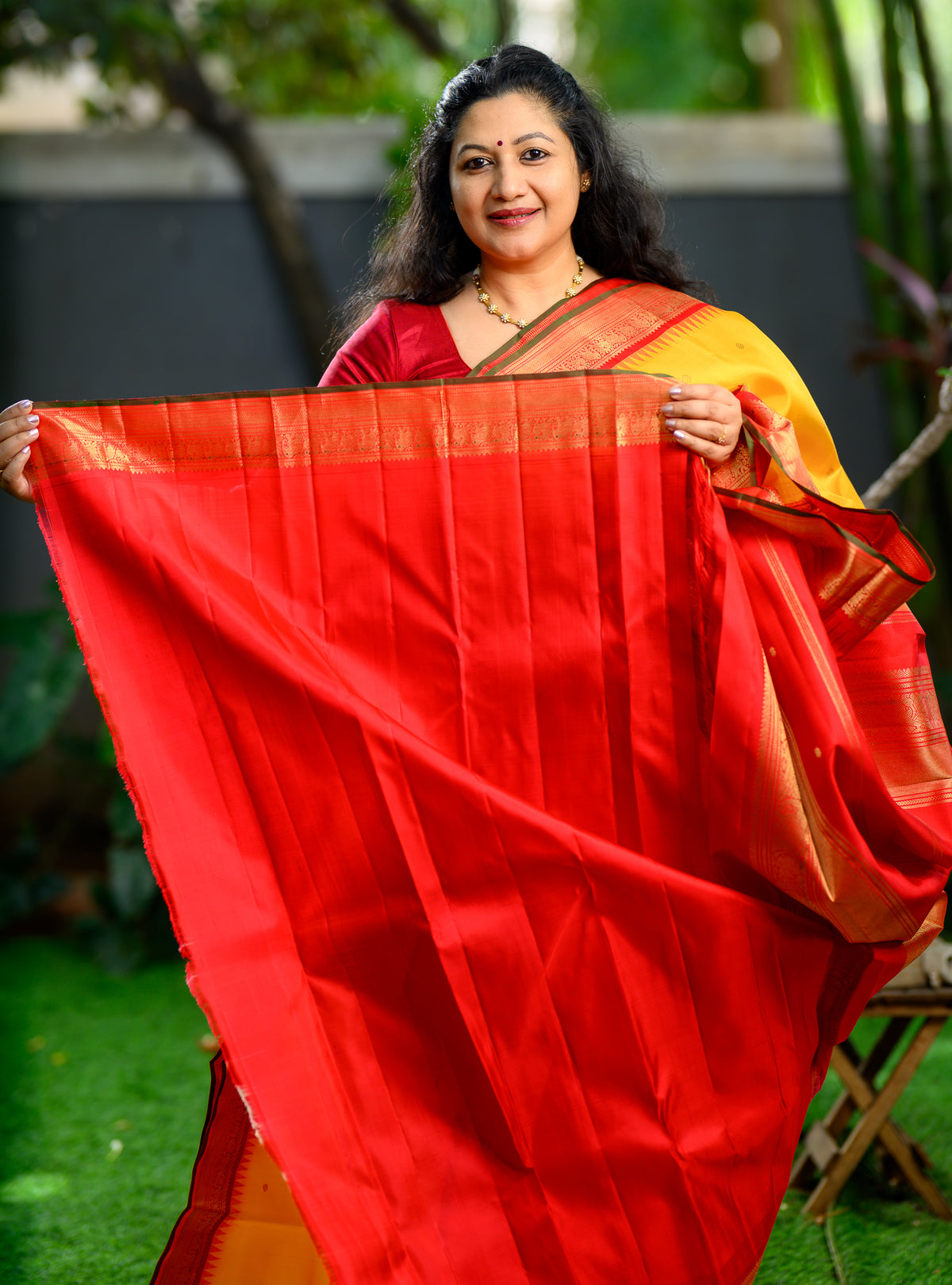 Pure silk, pure zari Korvai Kanchivaram in a beautiful turmeric yellow body, featuring elegant peacock and tiny Kamalam buttas.