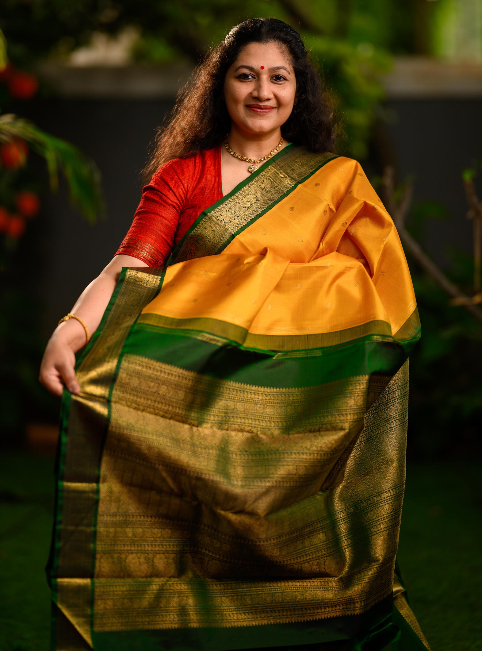 A beautiful pure silk, pure zari korvai kanjivaram in an evergreen combination of turmeric yellow body and emerald green border.
