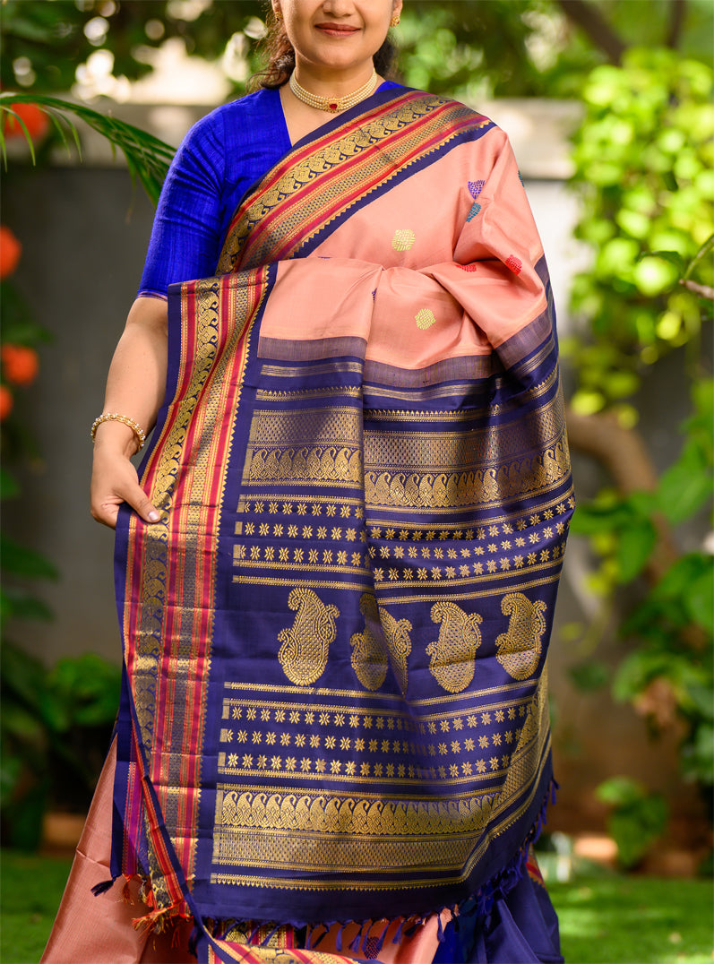 Geva Pink and Navy Blue come together in this Pure Silk, Pure Zari Korvai Kanjivaram.