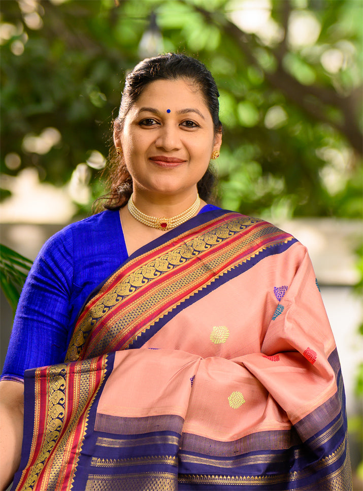 Geva Pink and Navy Blue come together in this Pure Silk, Pure Zari Korvai Kanjivaram.