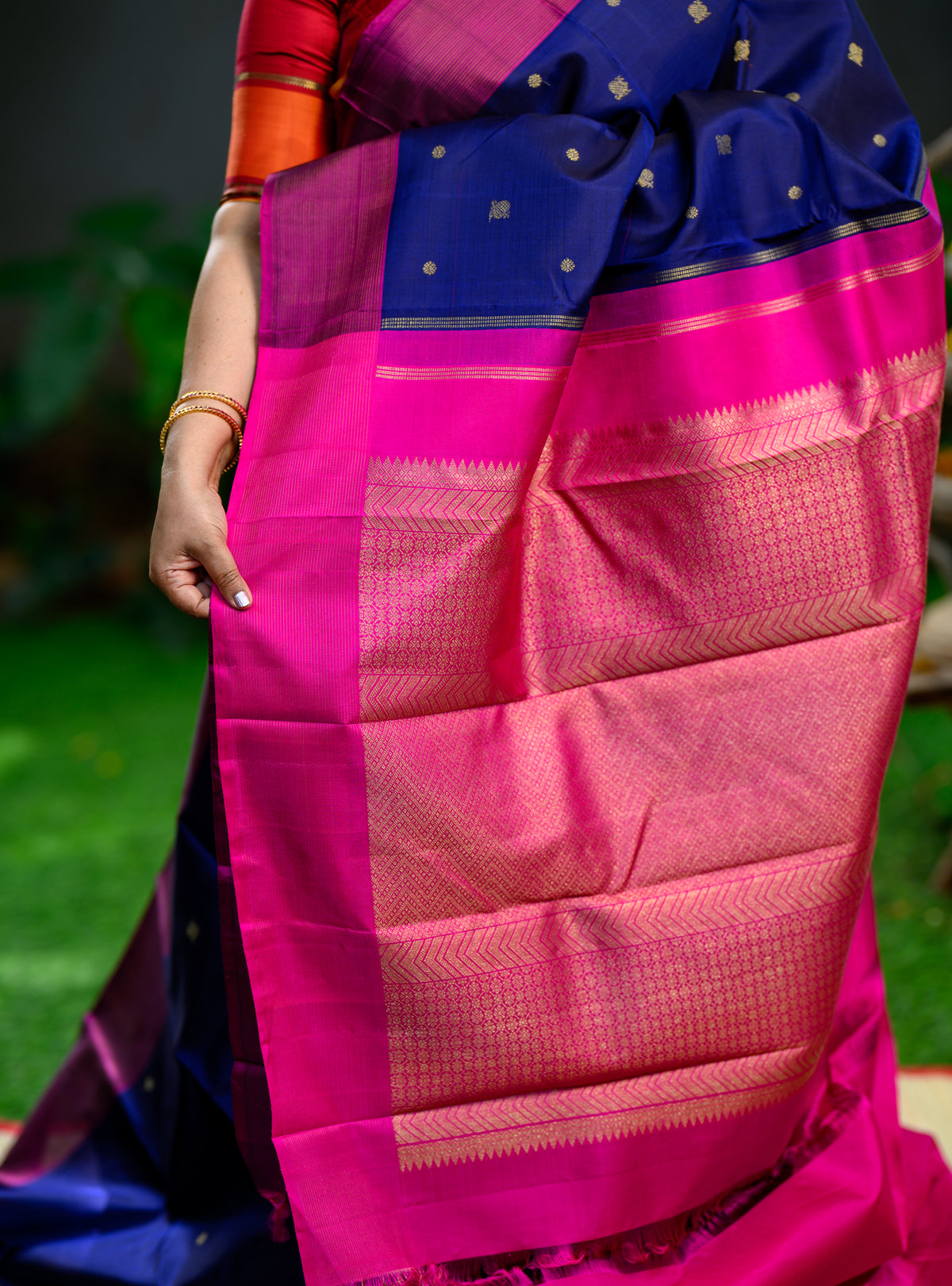 Beautiful pure silk, pure zari semi-contrast Kanchivaram in a striking combination of deep navy blue and rich magenta.