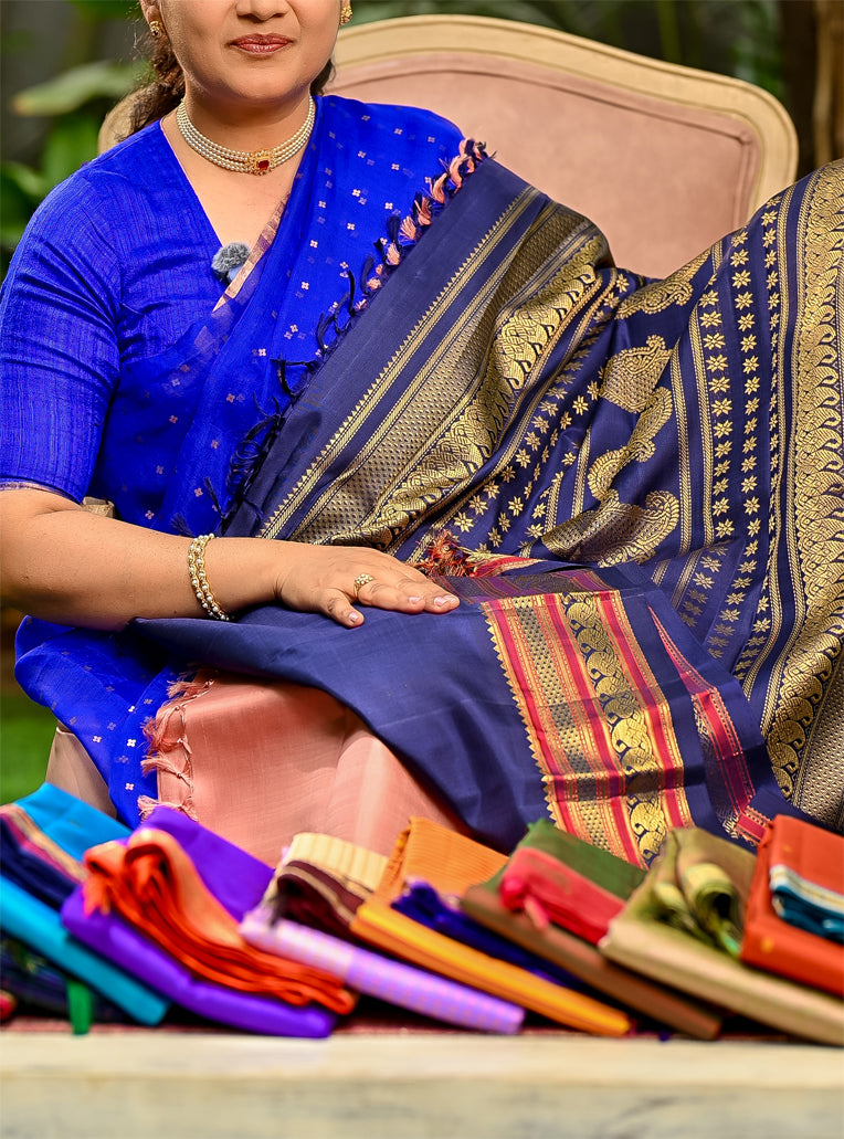 Geva Pink and Navy Blue come together in this Pure Silk, Pure Zari Korvai Kanjivaram.