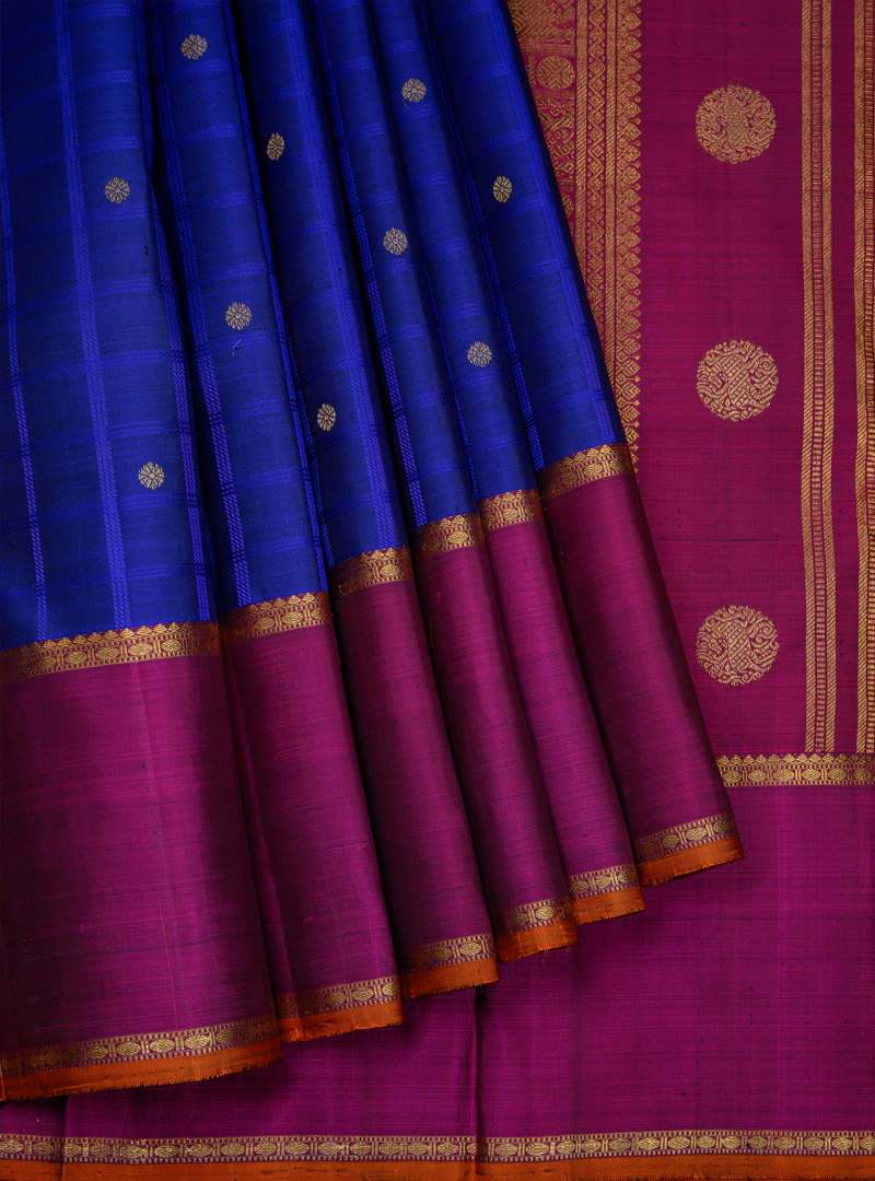 A semi contrast kanchivaram in blue and deep majenta