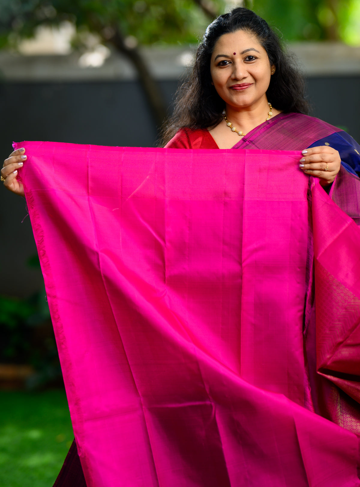 Beautiful pure silk, pure zari semi-contrast Kanchivaram in a striking combination of deep navy blue and rich magenta.