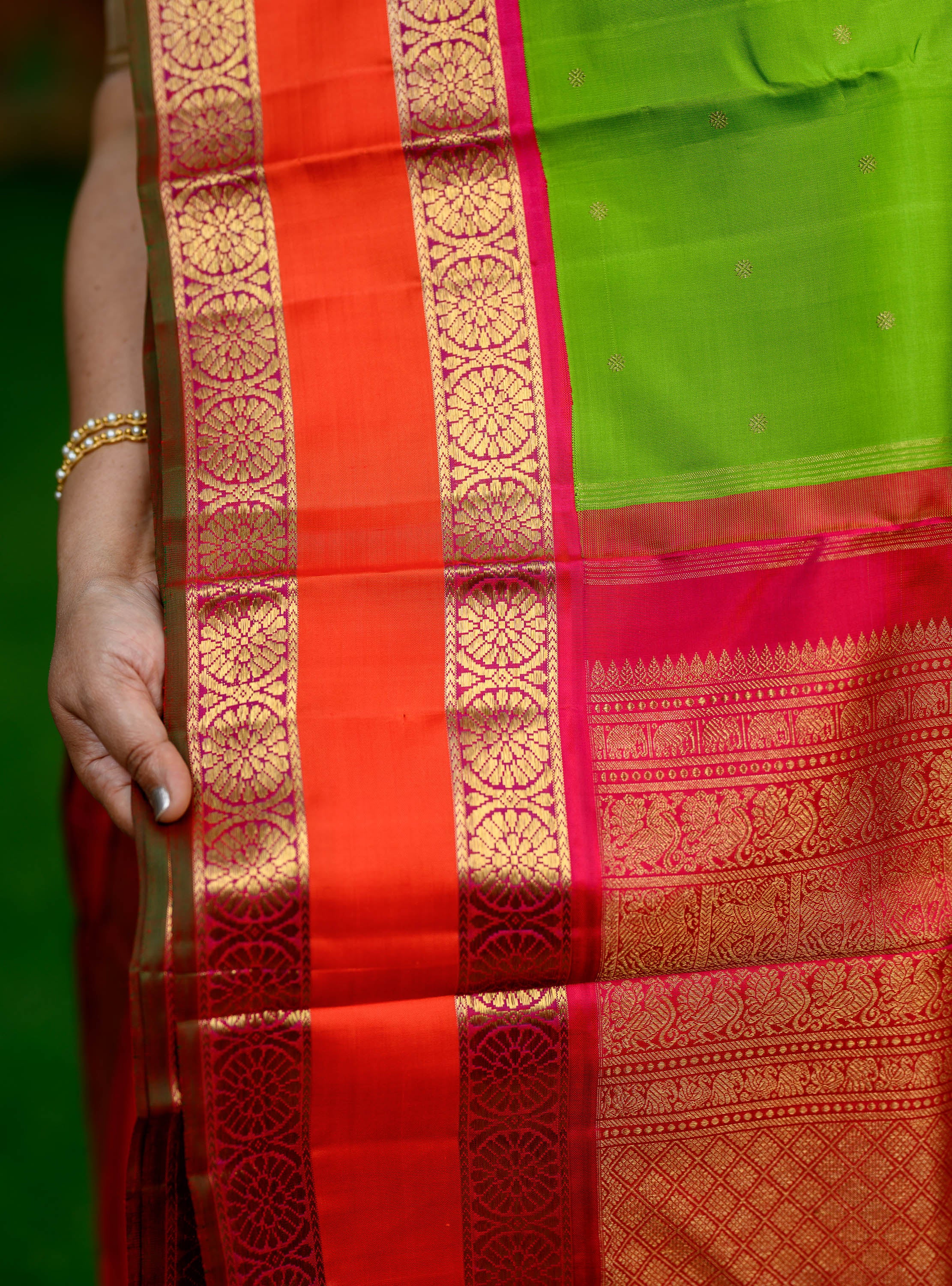 Parrot Green Korvai Kanjivaram with Pink Border