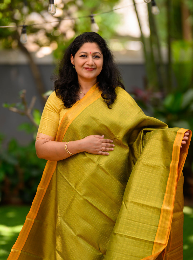 A Vintage  plus butta kanchivaram in light Green and yellow.