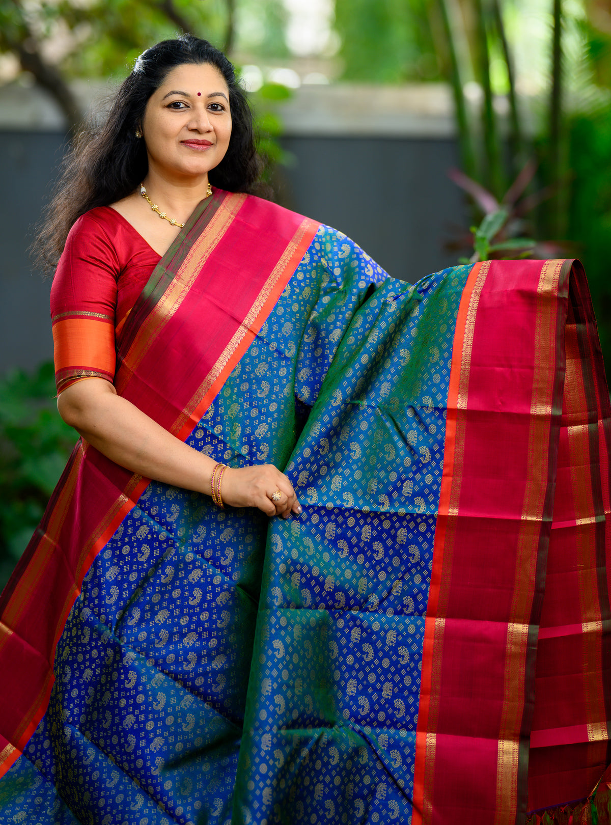 Korvai Kanjivaram with Peacock Green Body and Kalyana Arakku Border