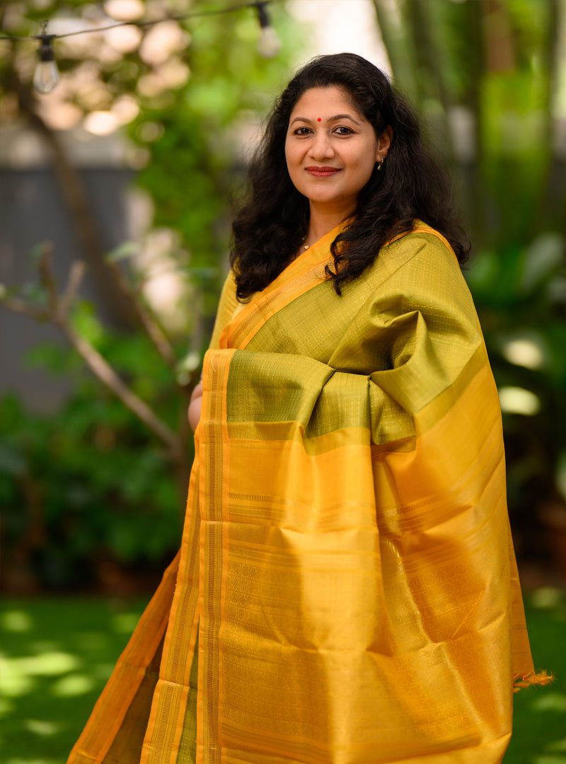 A Vintage  plus butta kanchivaram in light Green and yellow.