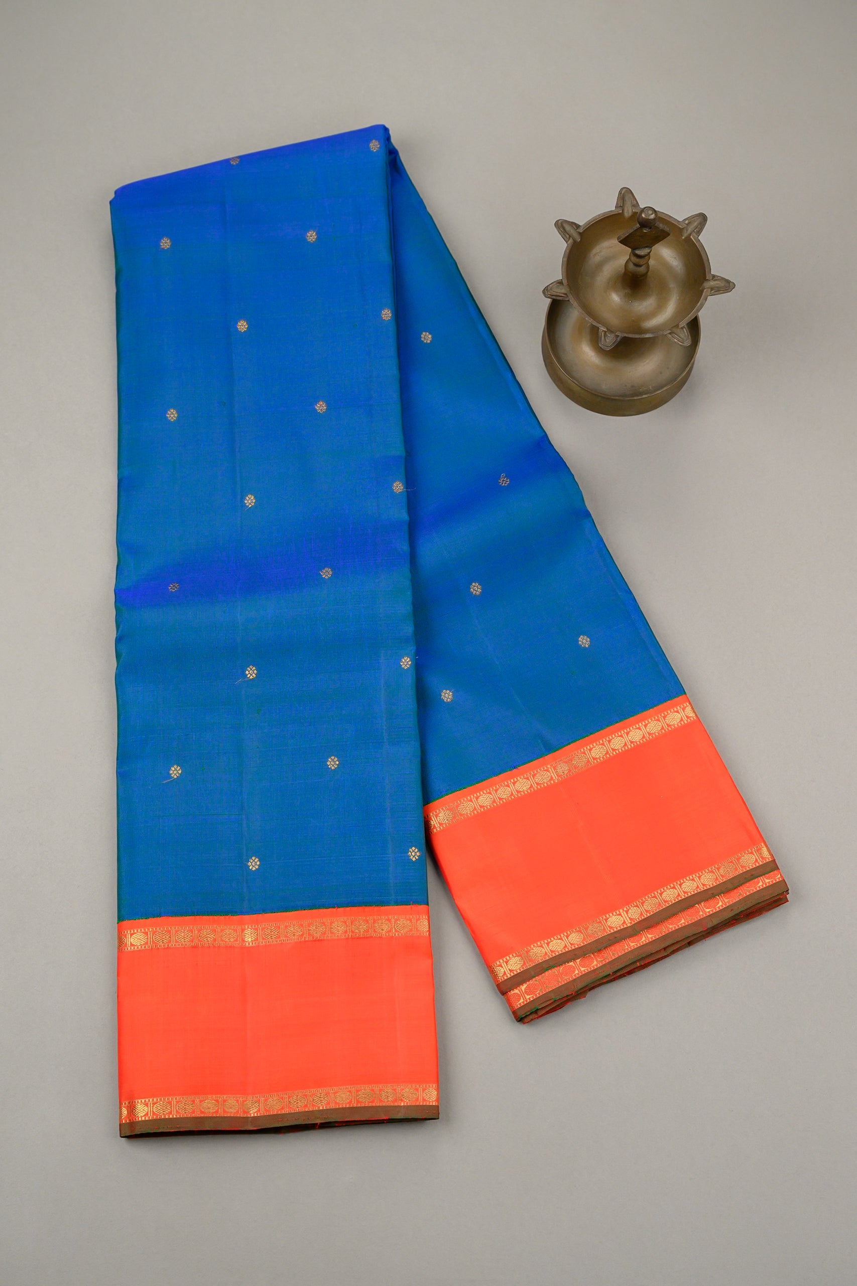 Mayilkazhuthu Blue Korvai Kanjivaram with Rettapettu Orange Border