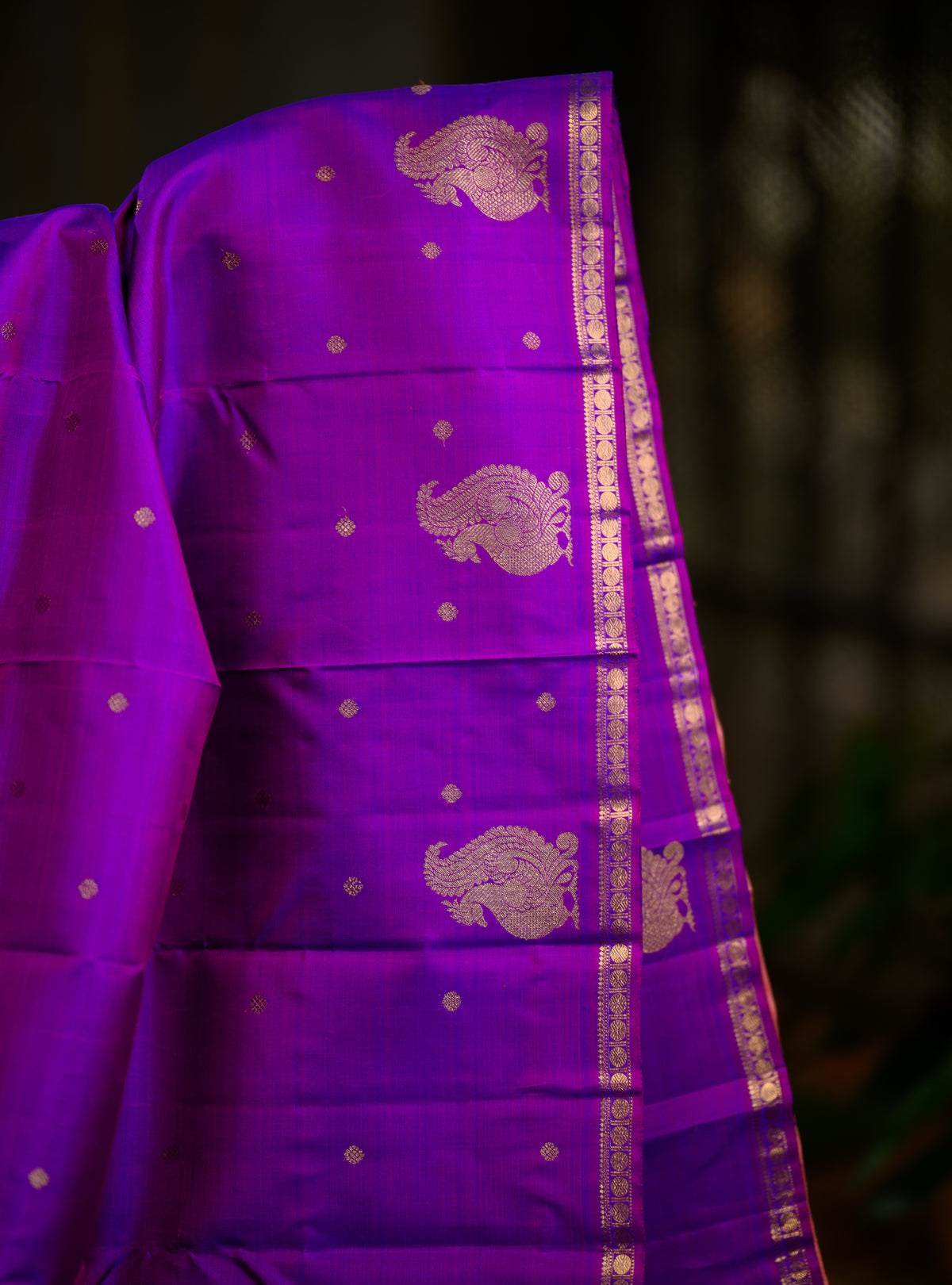 A beautiful pure silk, pure zari self Kanchivaram in a rich purple body with a soft pastel pink pallu.