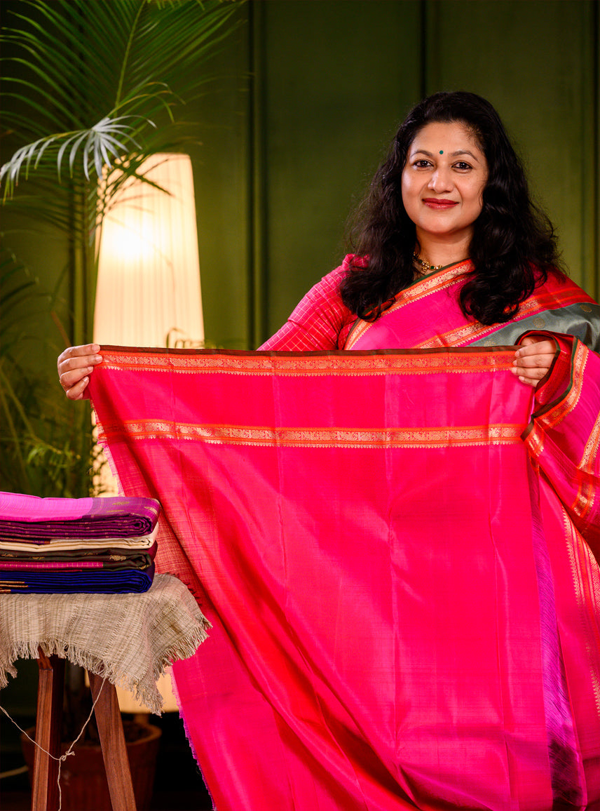 Elakkai Green and Rani Pink Korvai Kanjivaram
