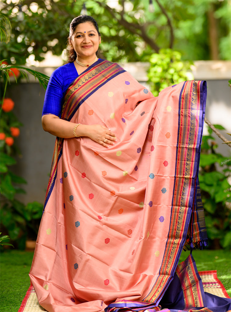 Geva Pink and Navy Blue come together in this Pure Silk, Pure Zari Korvai Kanjivaram.