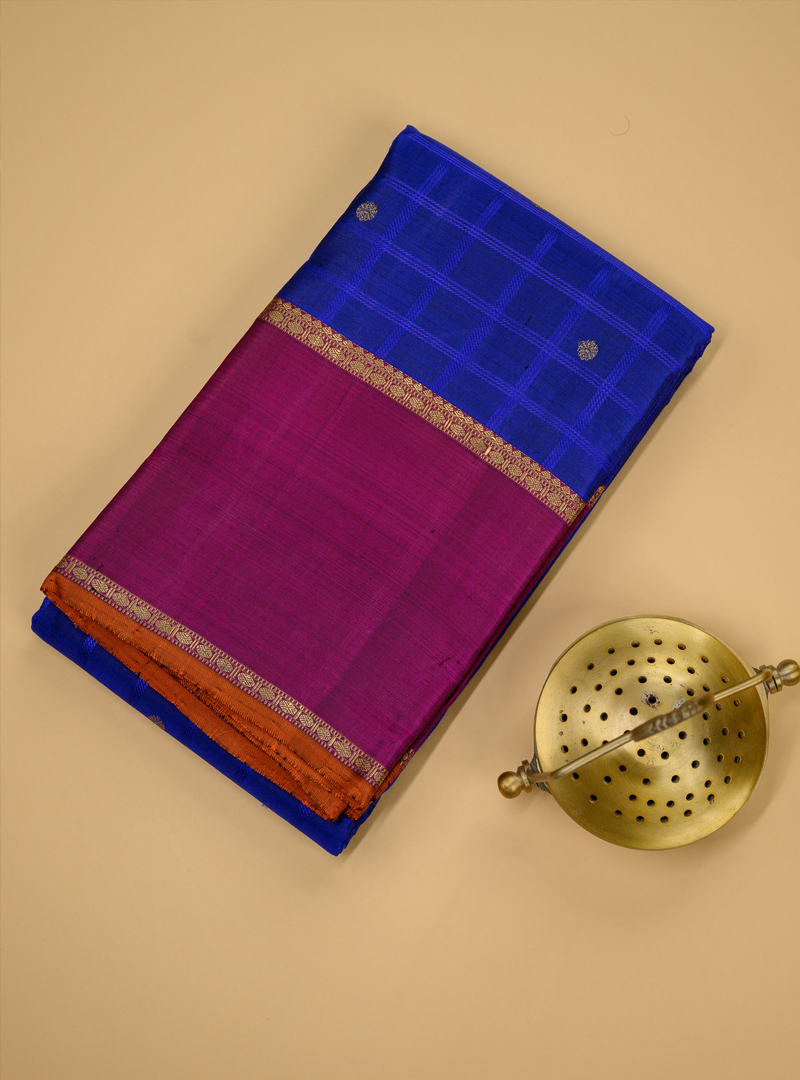 A semi contrast kanchivaram in blue and deep majenta