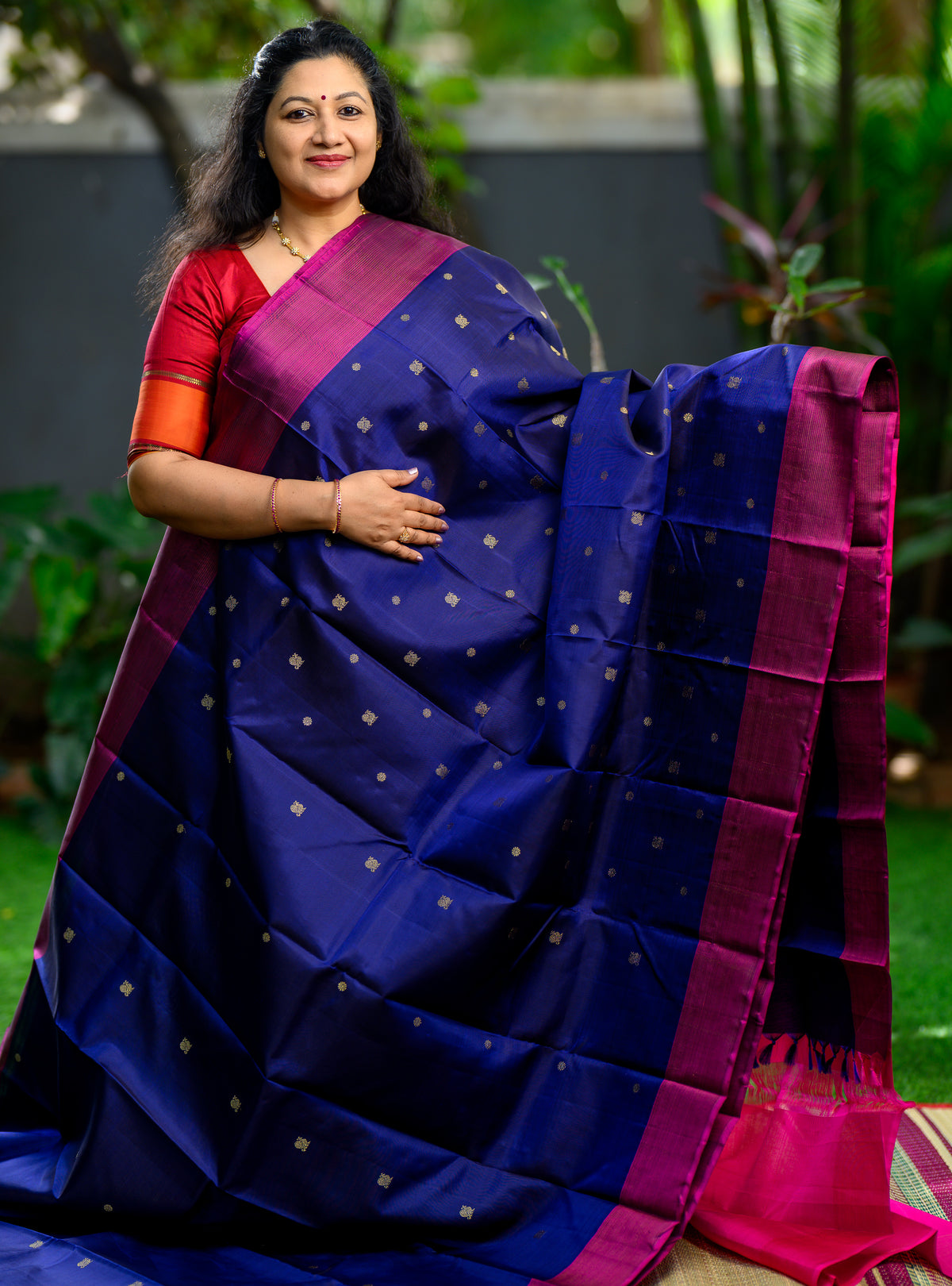 Beautiful pure silk, pure zari semi-contrast Kanchivaram in a striking combination of deep navy blue and rich magenta.