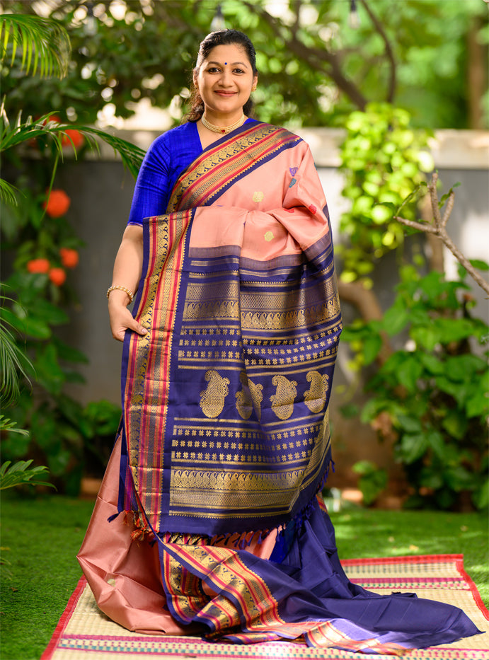 Geva Pink and Navy Blue come together in this Pure Silk, Pure Zari Korvai Kanjivaram.