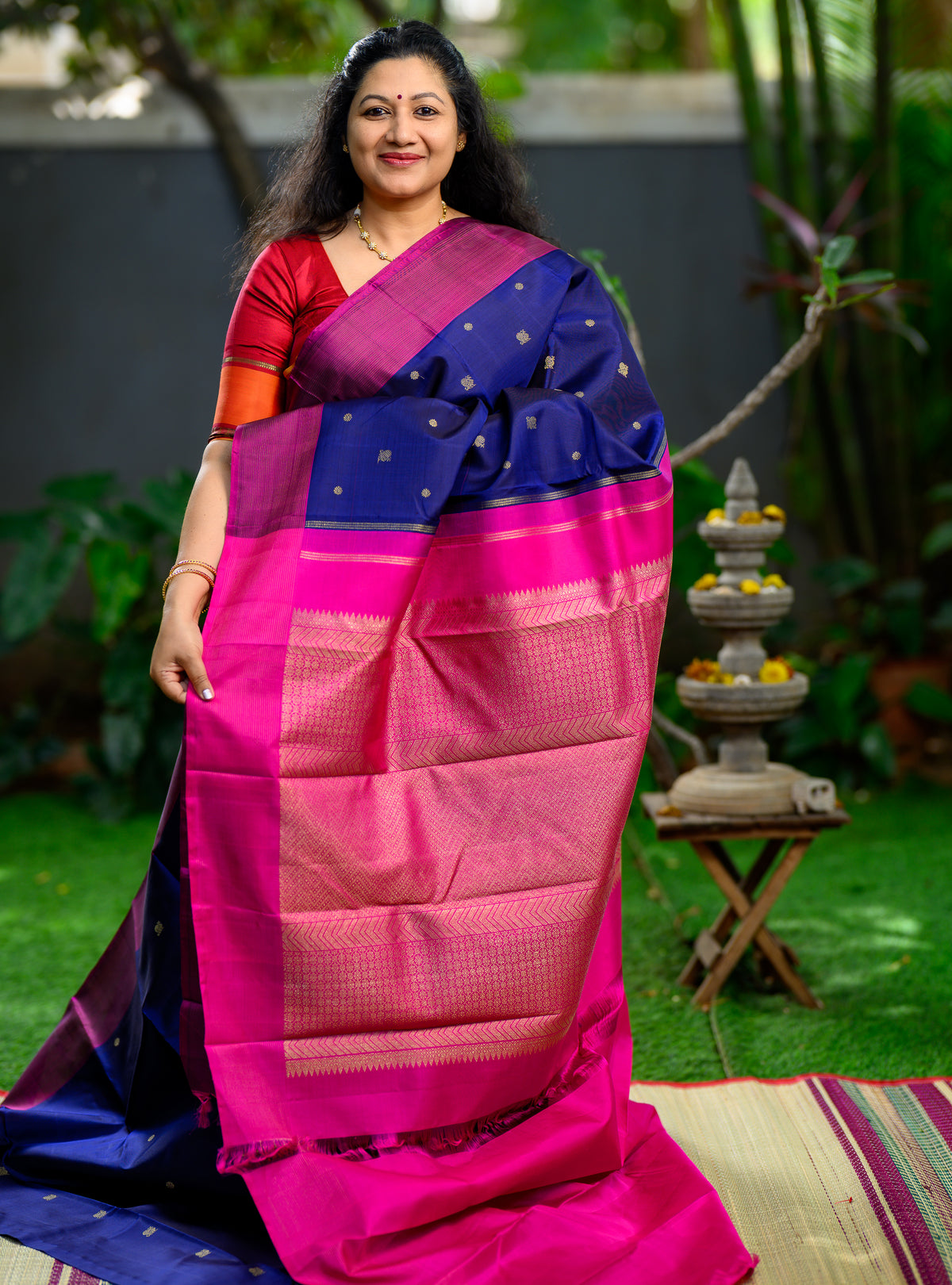 Beautiful pure silk, pure zari semi-contrast Kanchivaram in a striking combination of deep navy blue and rich magenta.