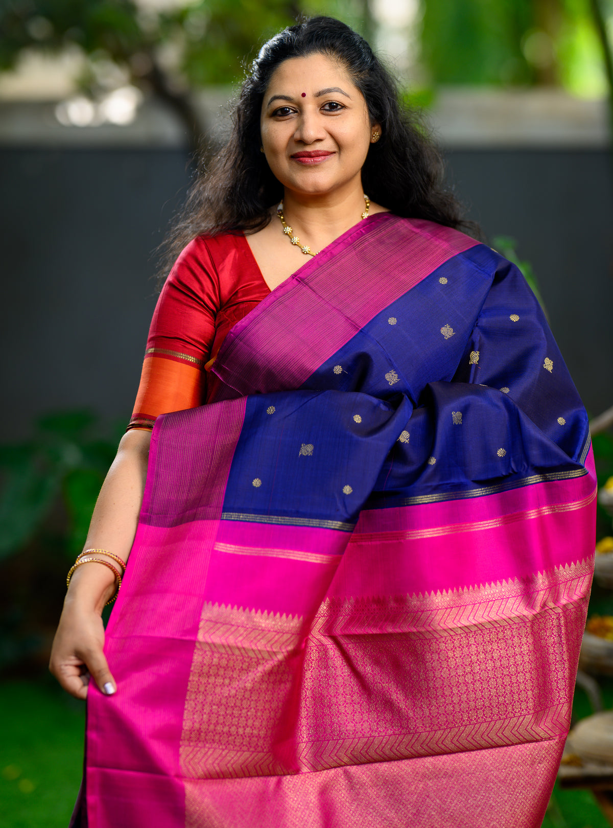 Beautiful pure silk, pure zari semi-contrast Kanchivaram in a striking combination of deep navy blue and rich magenta.
