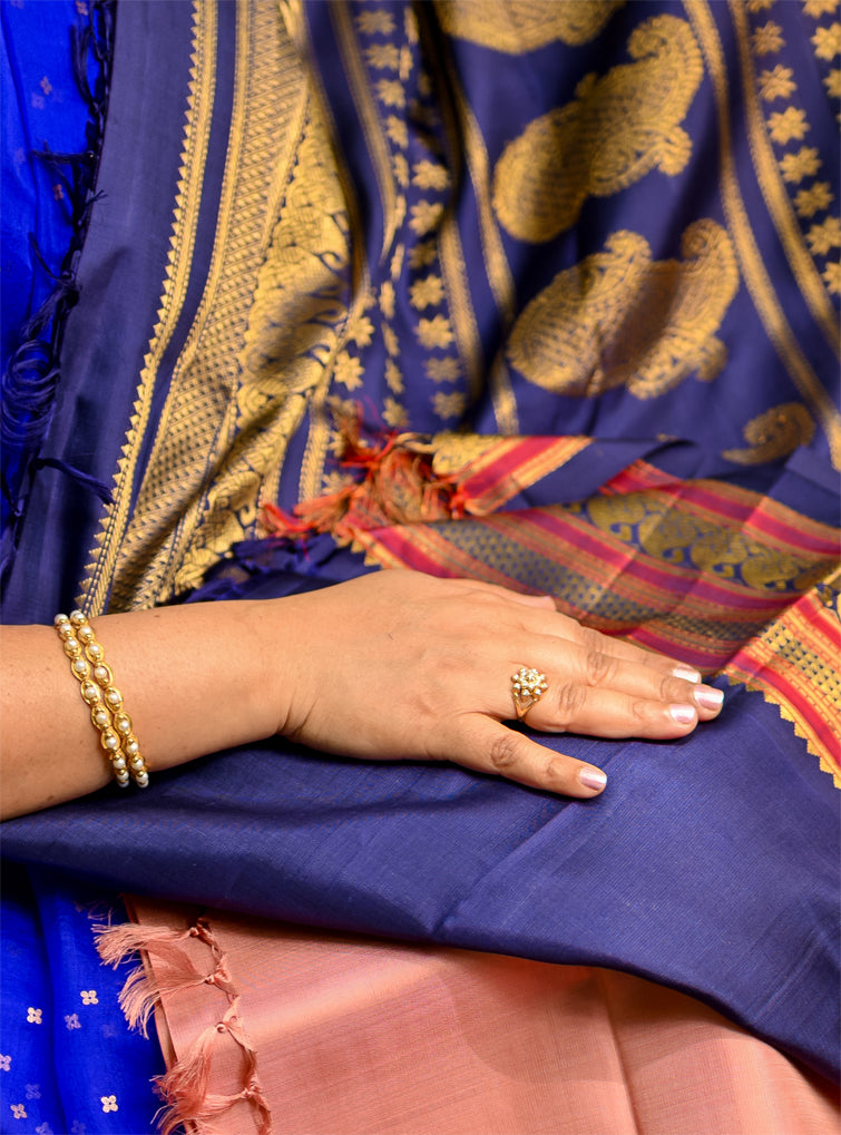 Geva Pink and Navy Blue come together in this Pure Silk, Pure Zari Korvai Kanjivaram.