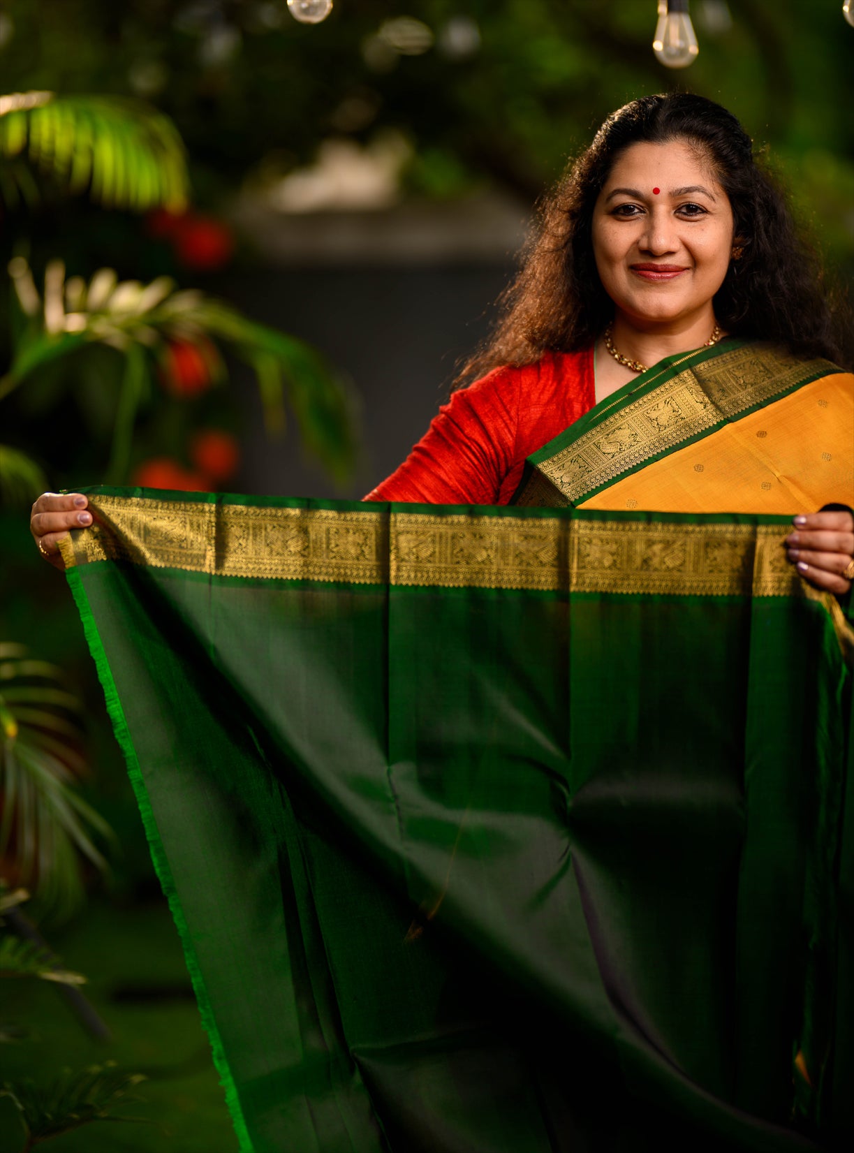 A beautiful pure silk, pure zari korvai kanjivaram in an evergreen combination of turmeric yellow body and emerald green border.