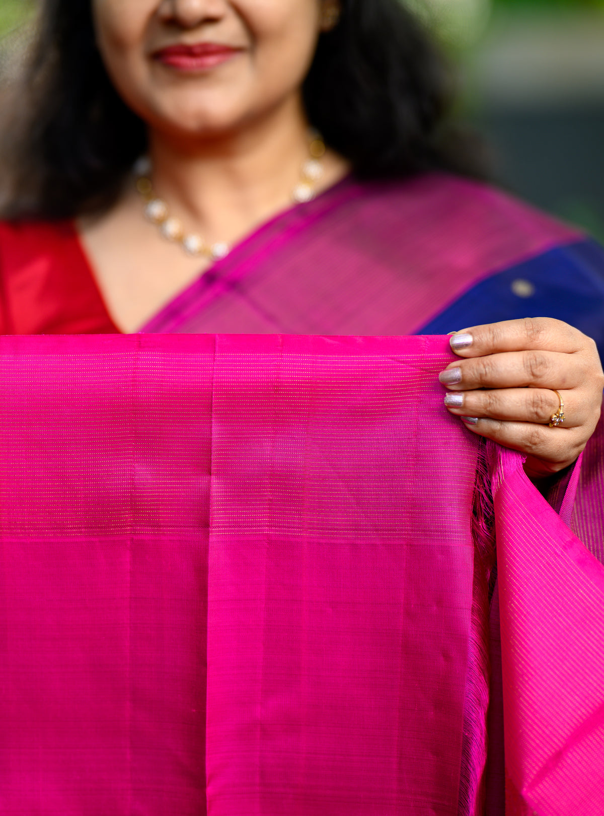 Beautiful pure silk, pure zari semi-contrast Kanchivaram in a striking combination of deep navy blue and rich magenta.