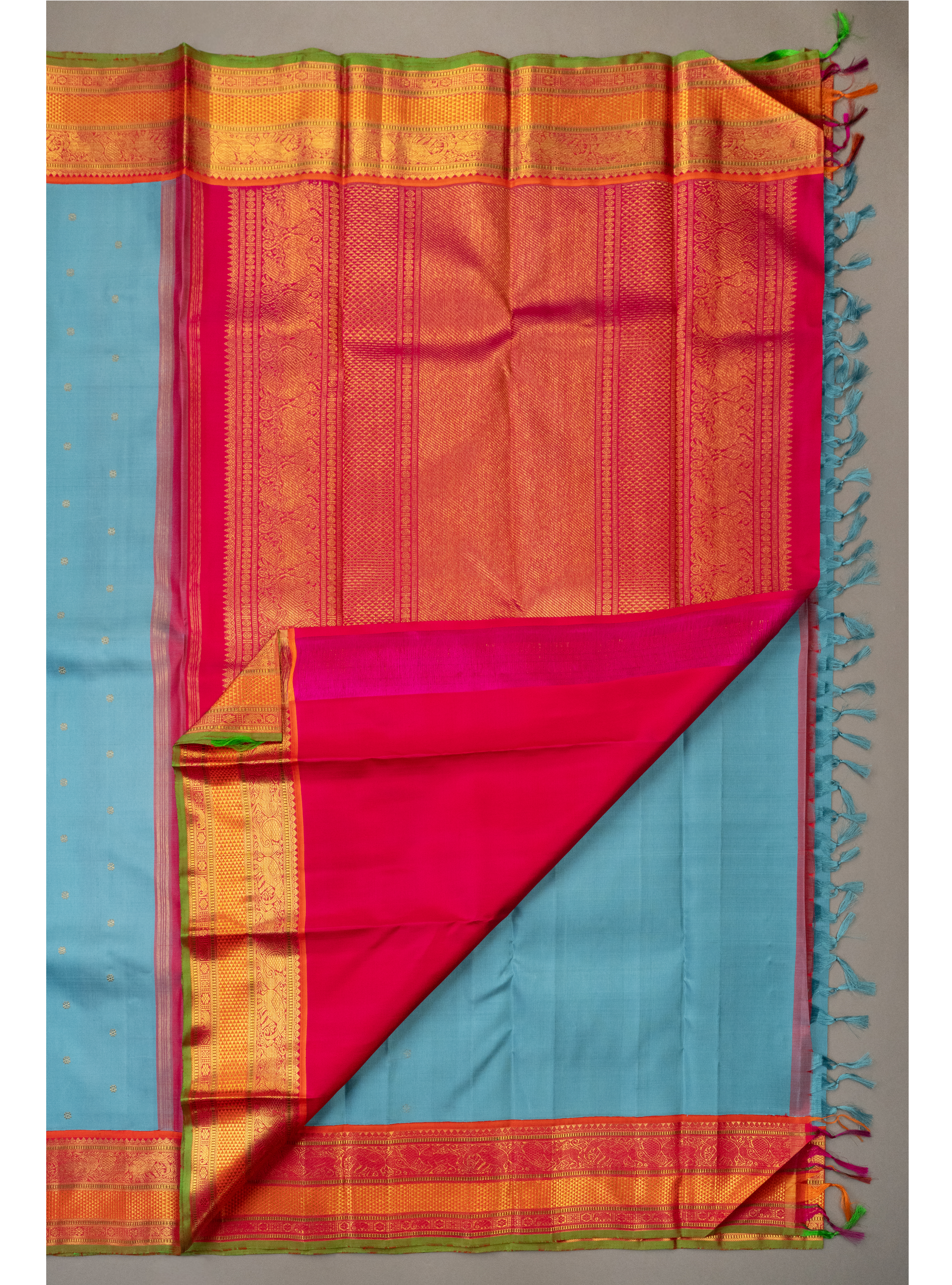 Turquoise blue saree with Orange Korvai border