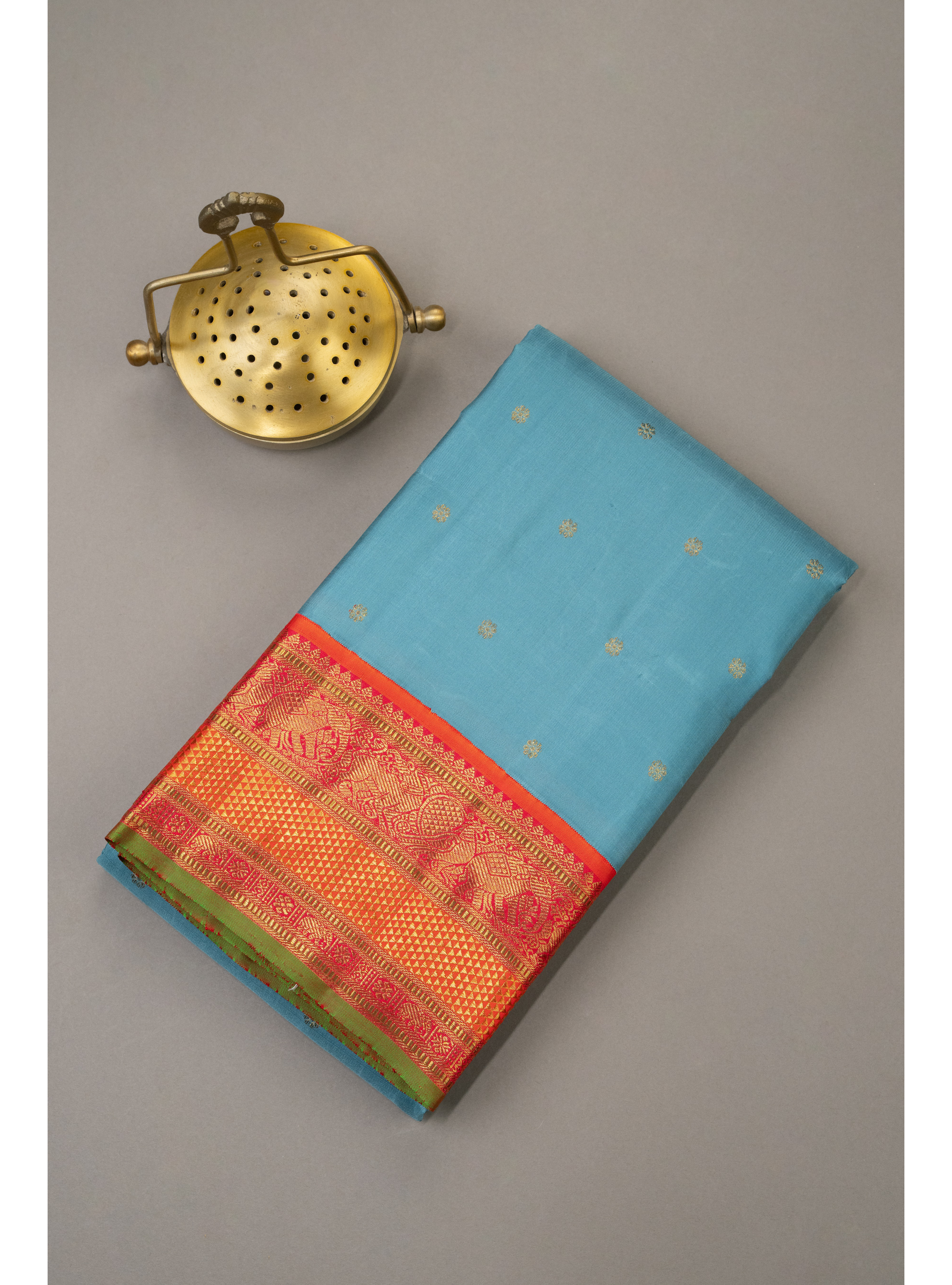 Turquoise blue saree with Orange Korvai border